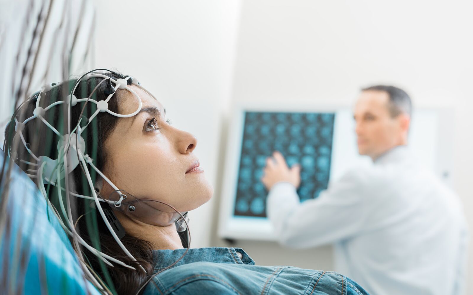 Charming young woman undergoing electroencephalography; Shutterstock ID 695951221; purchase_order: Main Visual; job: ; client: ; other: